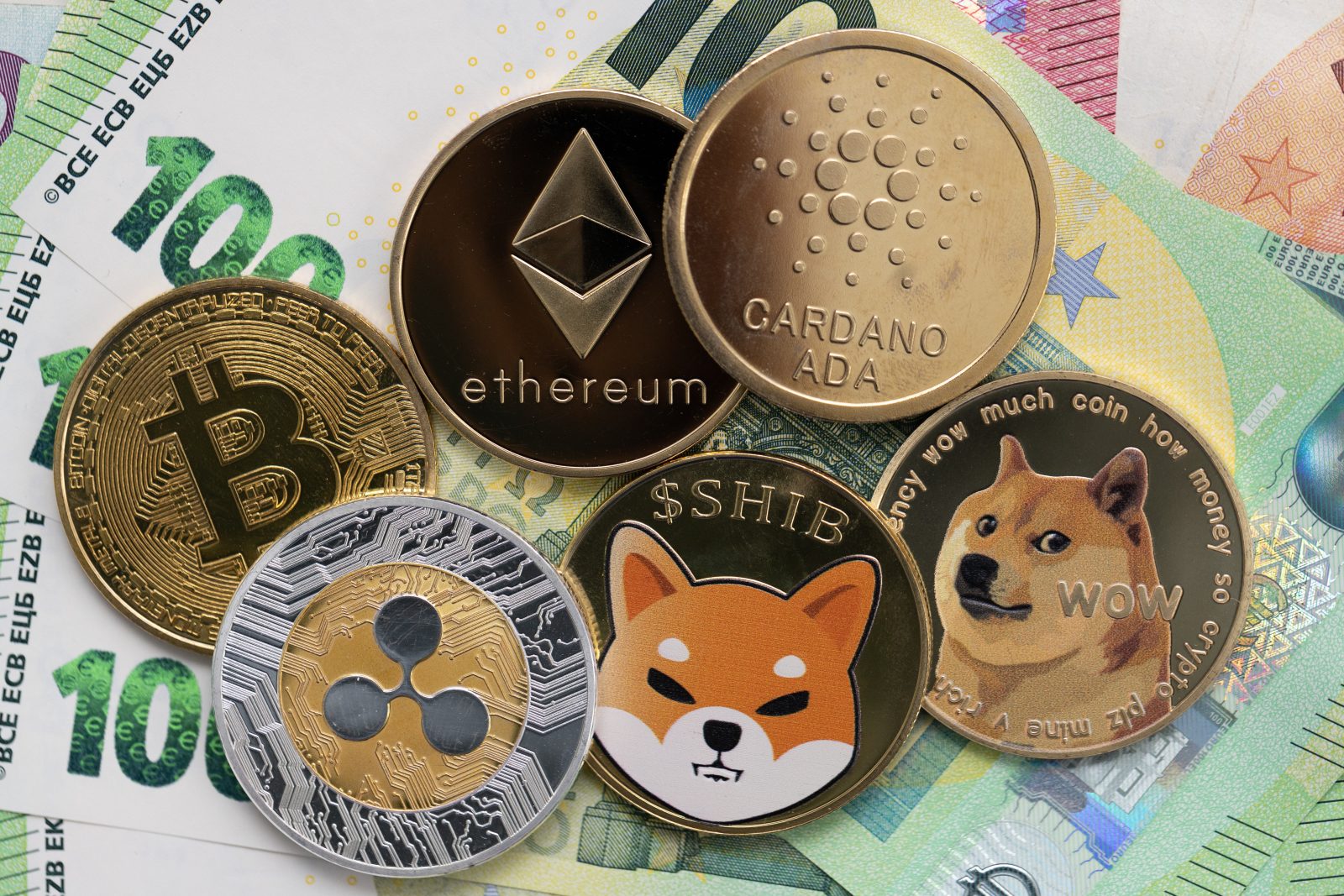 A collection of physical cryptocurrency coins, including Bitcoin (BTC), Ethereum (ETH), and XRP, are laid out on a bed of Euro banknotes. The image illustrates the intersection of digital assets and traditional fiat money, setting the context for the article's 2025 assessment of their real-world utility.