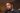 A close-up photo of NBA star Kevin Durant speaking into a microphone. The image is used in an article discussing his accidental, massive gains on a Bitcoin investment after being locked out of his Coinbase account.
