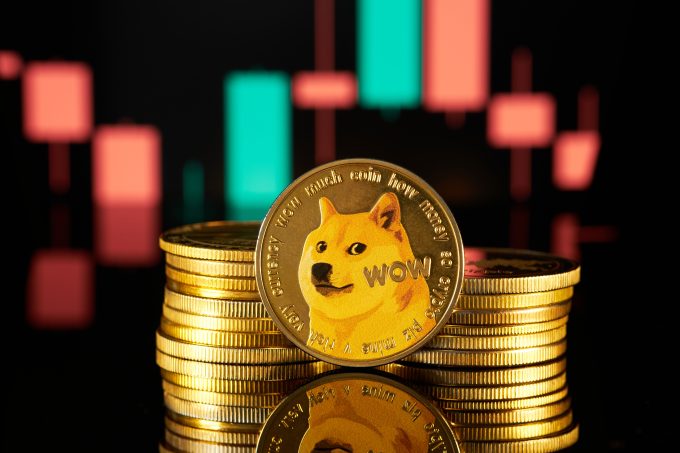 A physical Dogecoin is prominently displayed in front of a financial candlestick chart, symbolizing the cryptocurrency's aim for a $0.22 breakout as trading volume surges due to institutional catalysts.
