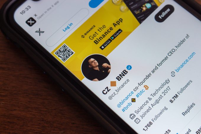A physical BNB coin is shown against a green, upward-trending financial chart. The image symbolizes the market rally and high volume for Binance Coin, as discussed in the October 2025 article following President Trump's pardon of Binance founder CZ.