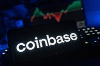 A smartphone displays the Coinbase logo, with a volatile financial chart blurred in the background. The image illustrates the crypto exchange (COIN) which is the subject of an October 2025 article about a JPMorgan upgrade and the potential of its Base token.