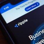 A close-up of the Ripple logo displayed on a smartphone screen. The image identifies the company at the center of the October 2025 article, where its executive is refuting the "crypto as crime" narrative by highlighting public ledger traceability.