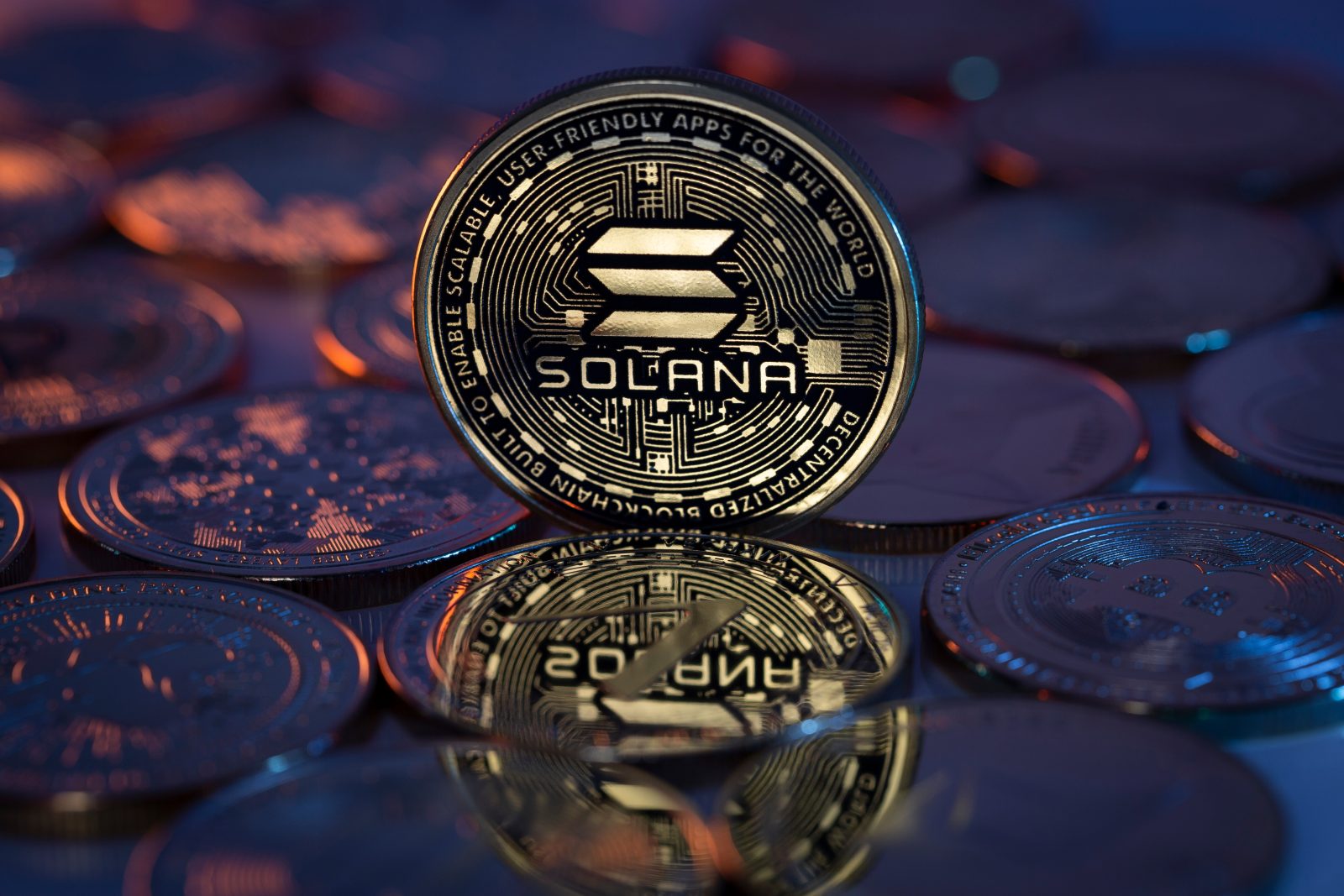 A physical Solana (SOL) coin is pictured, representing the cryptocurrency that recently gained a Fidelity listing but is facing price resistance near $195, with critical support at $188 looming, as detailed in the October 2025 article.